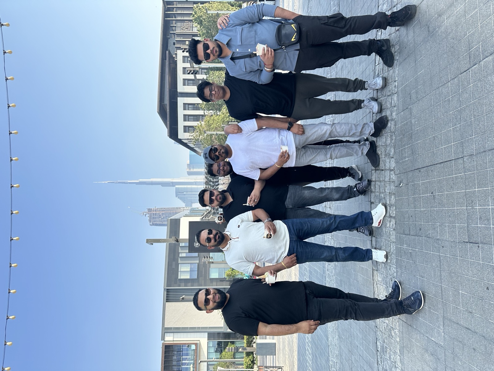 Tazz Miah with colleagues in Dubai, Burj Khalifa in the background